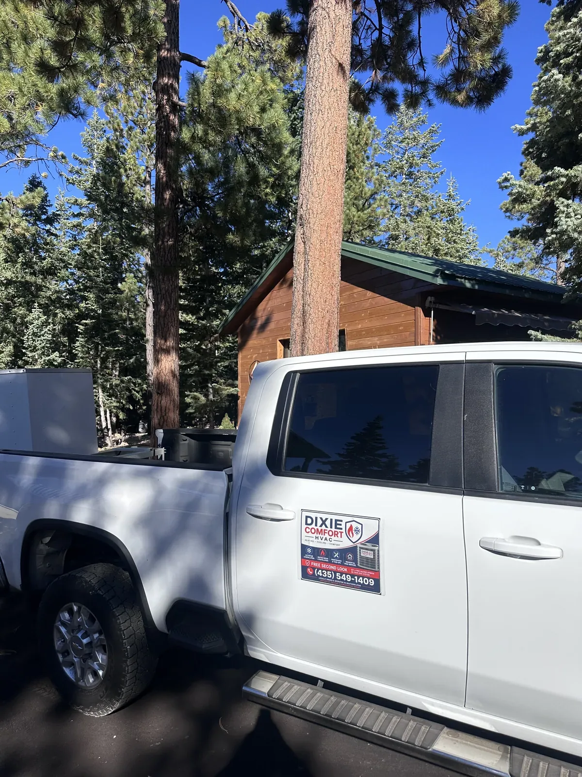 Dixie Comfort HVAC service truck at a mountain cabin job site in Duck Creek Village, Utah