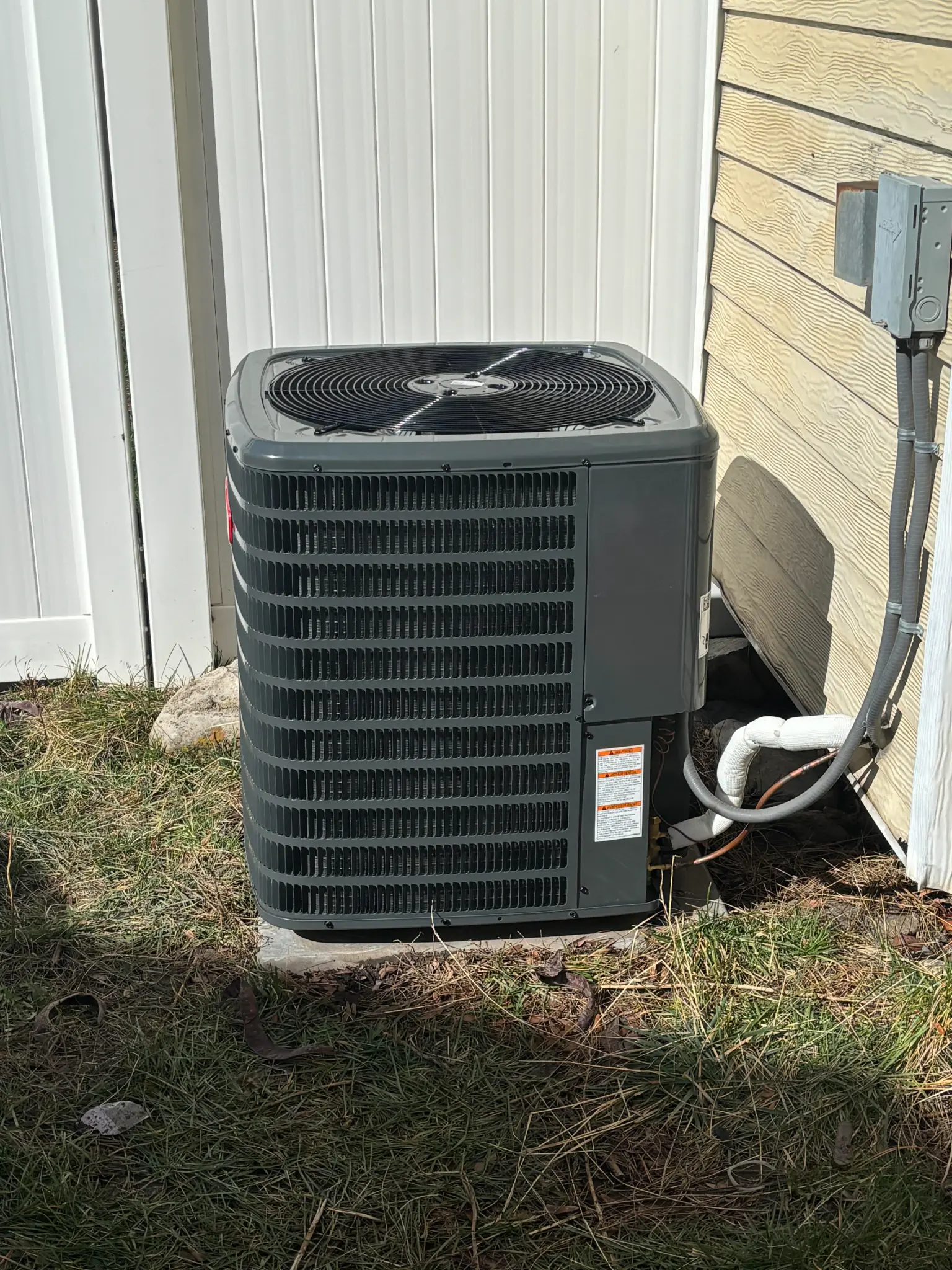 Completed AC condenser replacement with insulated line set at a St. George area residence